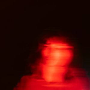 Blurry silhouette of a man moving during an intense session