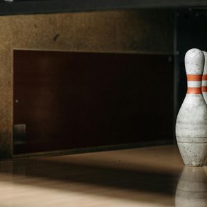 Close up of sports equipment on a dark wooden floor